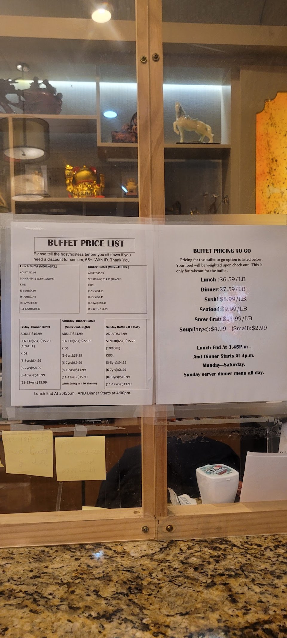 Asian buffet menu beside takeout details